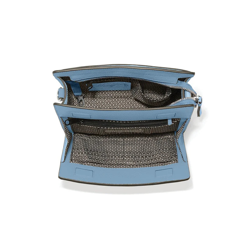 Close-up of the front organizer pocket on the Findley bag showing the ID window and credit card slots.
