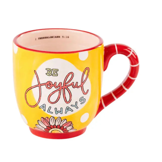 Hand-painted "Be Joyful Always" 16 oz ceramic mug with yellow polka dots, floral base, and red striped handle.
