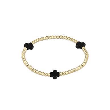 An enewton Signature Cross classic 3mm gold bead bracelet featuring stark black onyx accent crosses and 14kt gold-filled beads on stretch elastic.