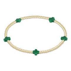 An enewton Signature Cross small 2mm gold bead bracelet featuring emerald green accents and 14kt gold-filled beads on a stretch elastic cord.