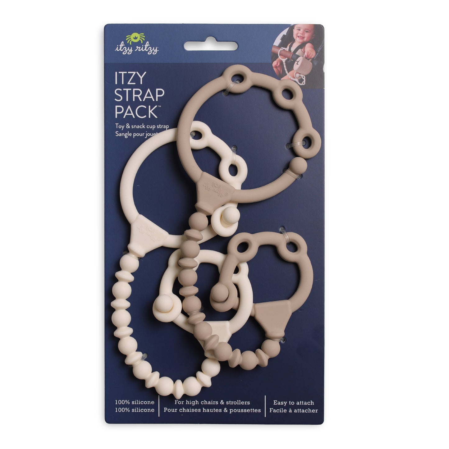 Itzy Ritzy Itzy Strap Pack in beige silicone attached to a stroller handle holding a snack cup and toy
