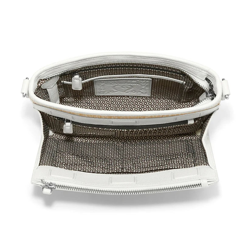 Close-up of the exterior organizer pocket on the Jordyn Straw Bag showing credit card slots and ID window.