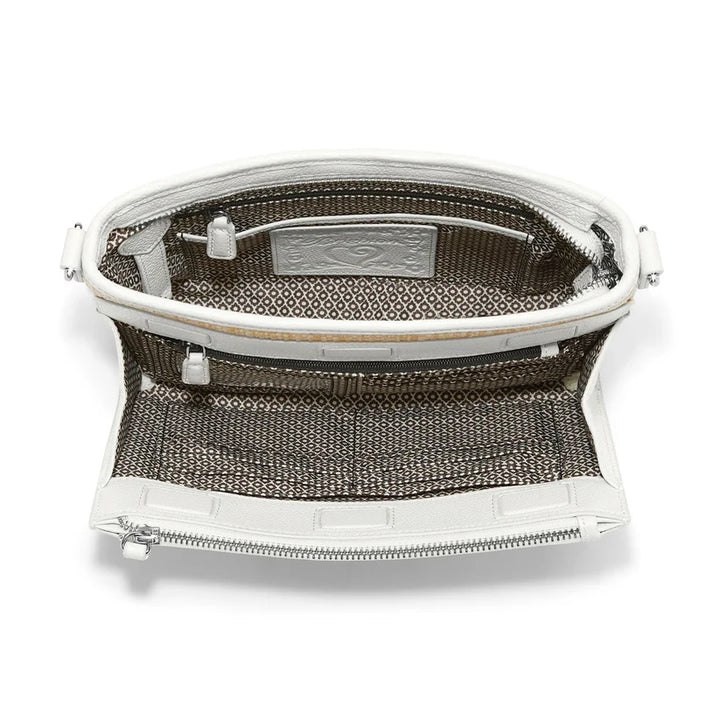 Close-up of the exterior organizer pocket on the Jordyn Straw Bag showing credit card slots and ID window.