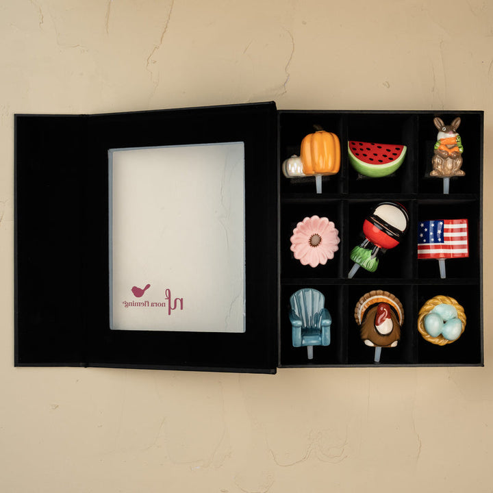 Open Nora Fleming keepsake box showing 9 individual compartments for mini storage.