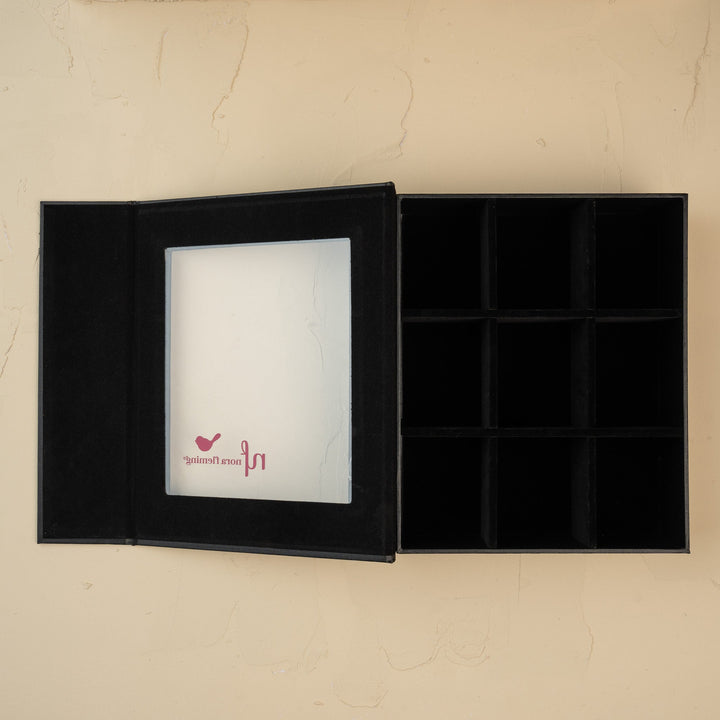 Nora Fleming 9-piece keepsake storage box with a sleek black finish.