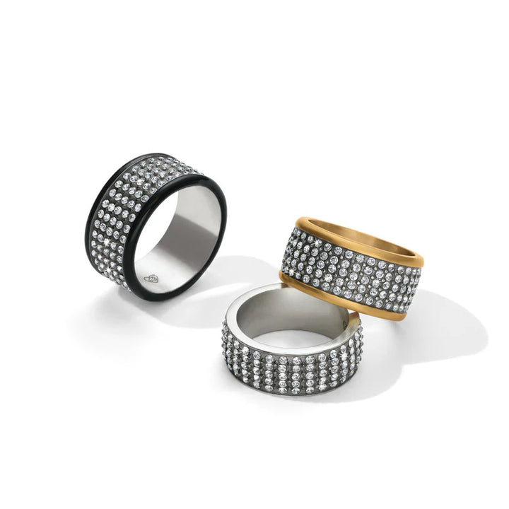 A stack of Brighton Meridian Rings showing the Silver, Gold, and Black Lacquer finishes together.