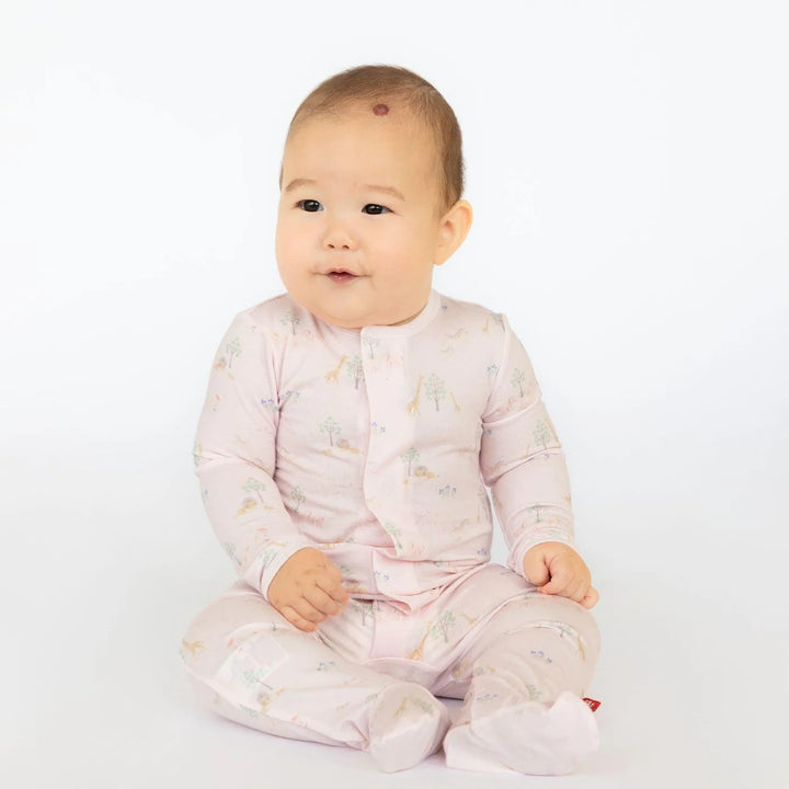 Magnetic Me Pink Serene Safari Modal Magnetic Footie featuring a pink animal print with lions and giraffes.