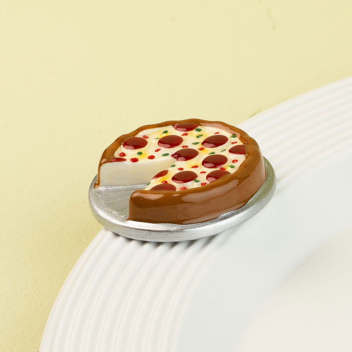 Close-up detail of the ceramic Nora Fleming Slice, Slice, Baby! pizza mini.