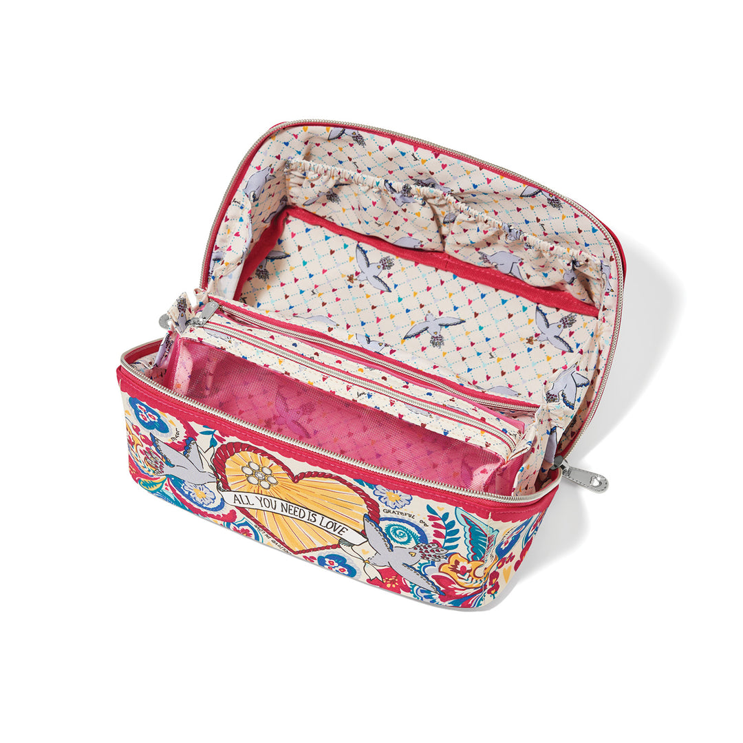 Top-down view inside the Brighton Love Story makeup case with mesh pouch and three interior pockets