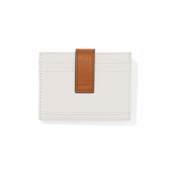 Brighton Collectibles White Contempo Card Case highlighting its crisp white leather body, brown leather strap, and iconic silver-tone hardware.