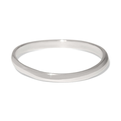 Close-up of the polished silver finish on the Cascade Rio Bangle showing its fluid, liquid-like curves.