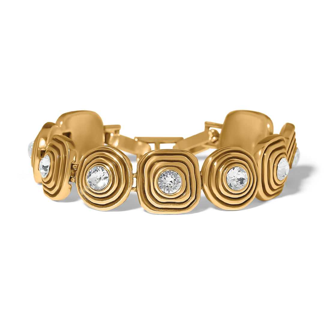 Brighton Collectibles Kosmos Kaleidoscope Gold Bracelet highlighting its geometric interlocking gold-tone cuff design styled on a wrist.