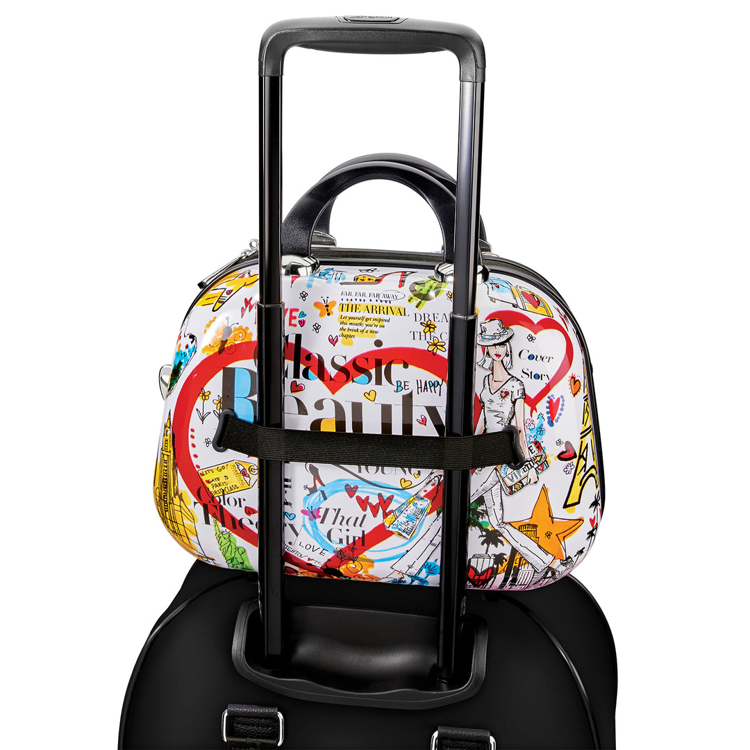 Brighton Headlines Cosmetic Case featuring a hard-shell exterior with multi-colored Fashionista headline art.