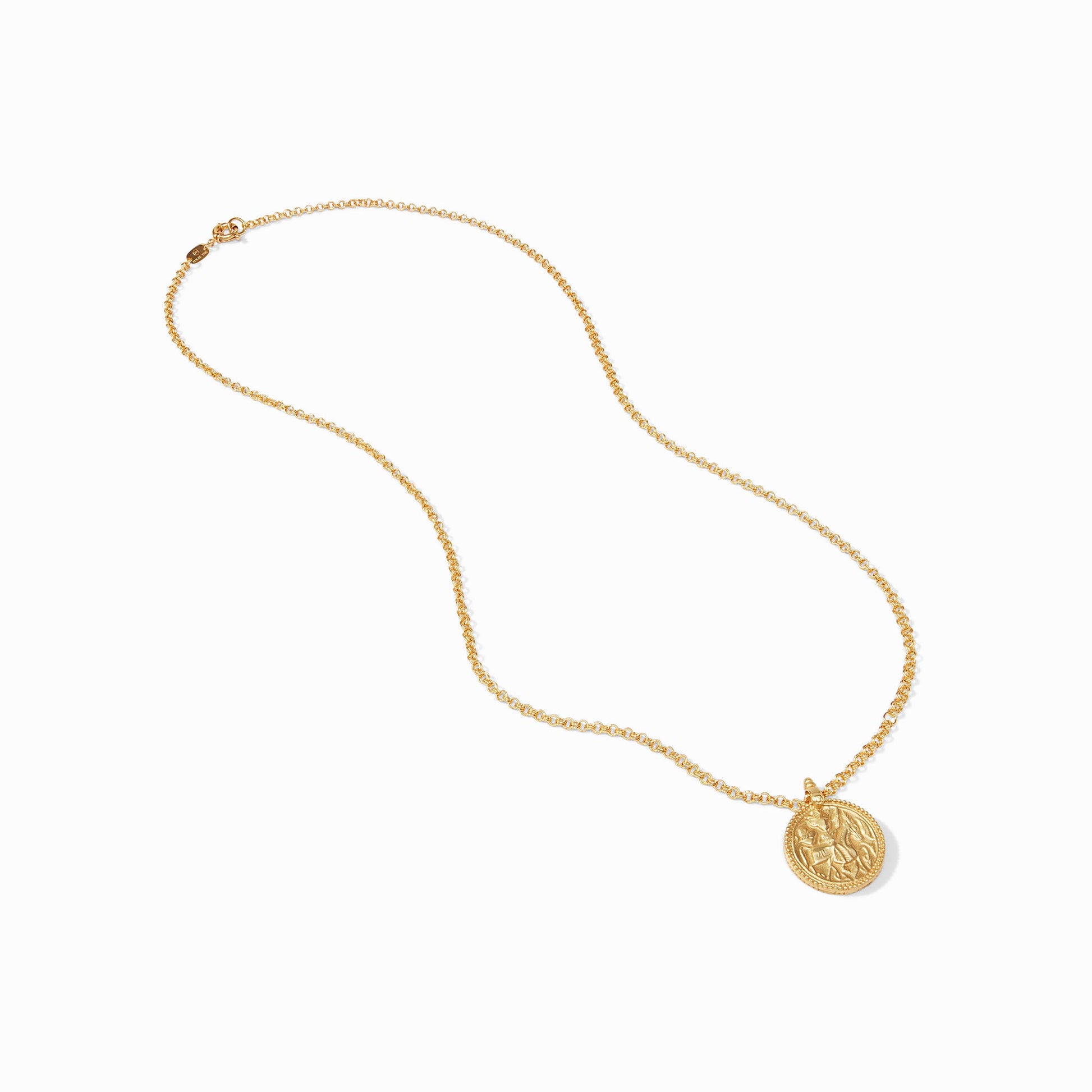 Close-up of the carved coin pendant and the authentic Julie Vos hallmark.