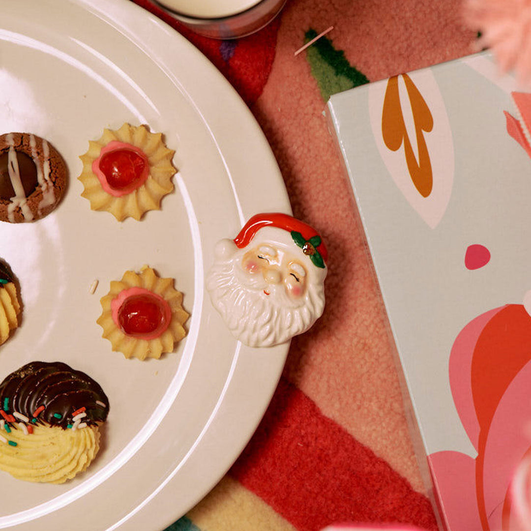 Nora Fleming Jolly Old Soul Santa mini styled on a Nora Fleming base for Christmas entertaining