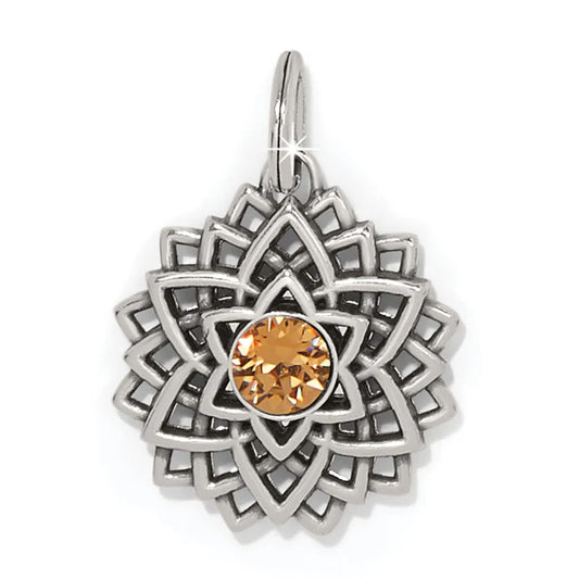 Brighton Serenity Amulet in silver plate featuring a geometric sunburst design with a central orange crystal.