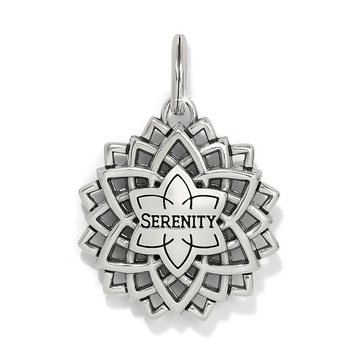 Back view of the Serenity Amulet showing the polished silver finish and the etched "Serenity" message.