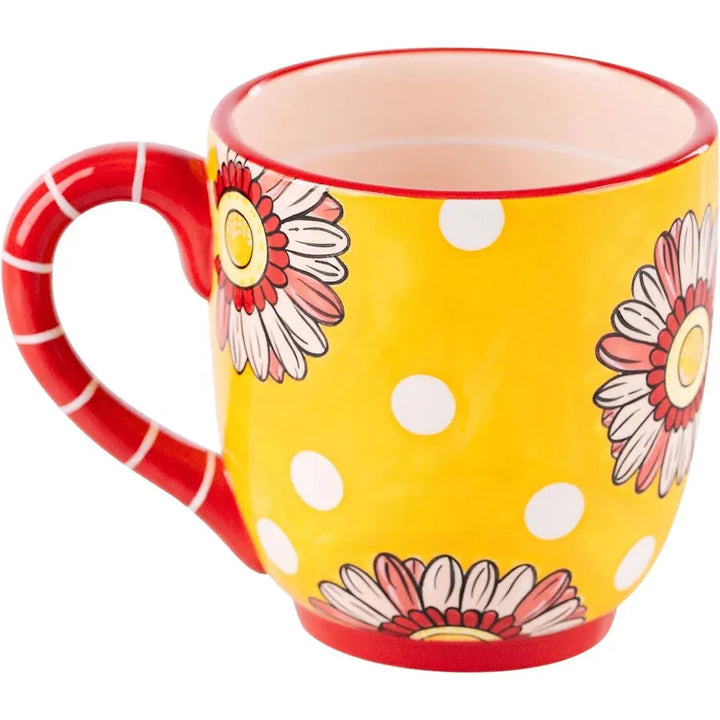 Matching ceramic spoon tucked into the handle of the "Be Joyful Always" mug.