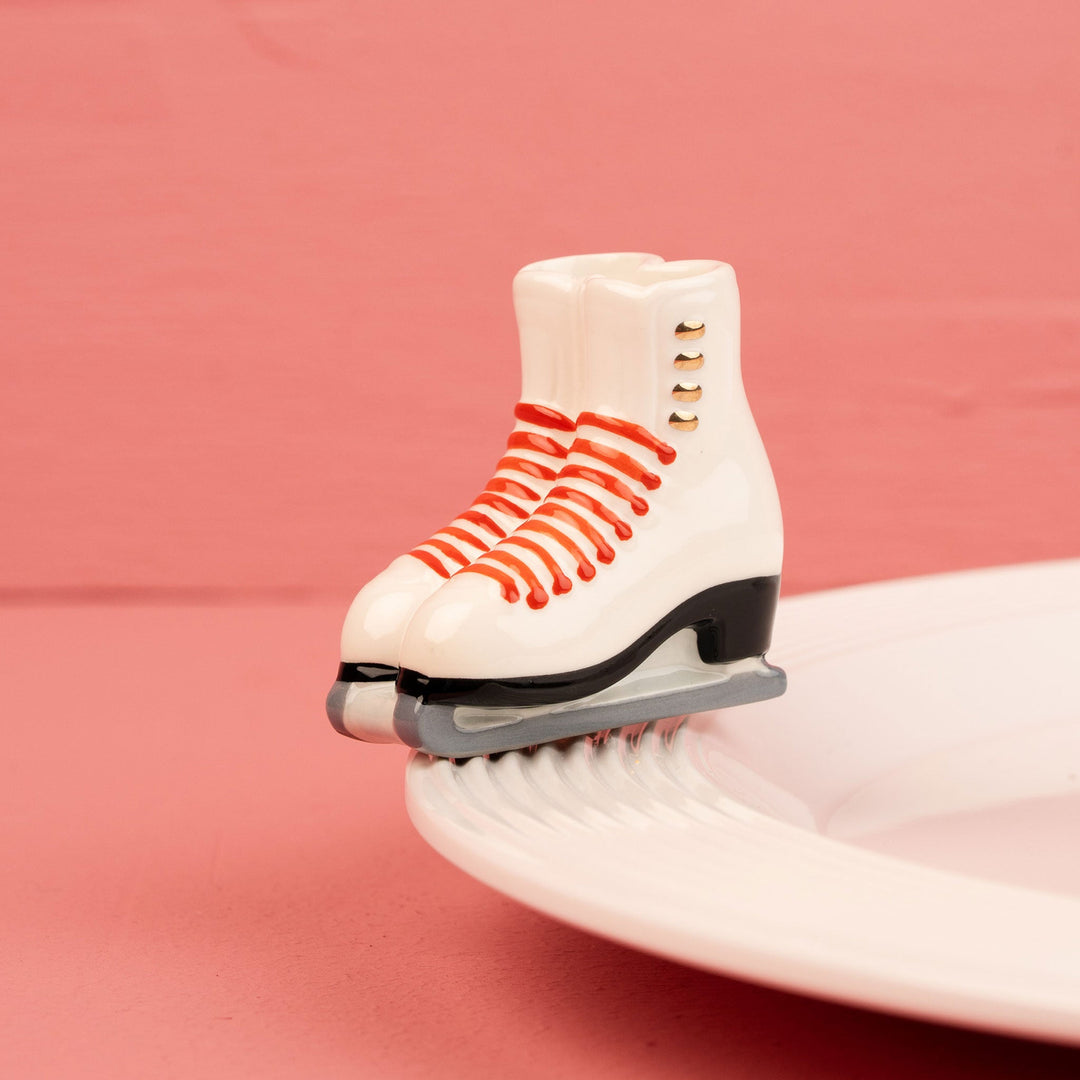 Nora Fleming Rink Ready hand-painted white ice skate mini with festive red details