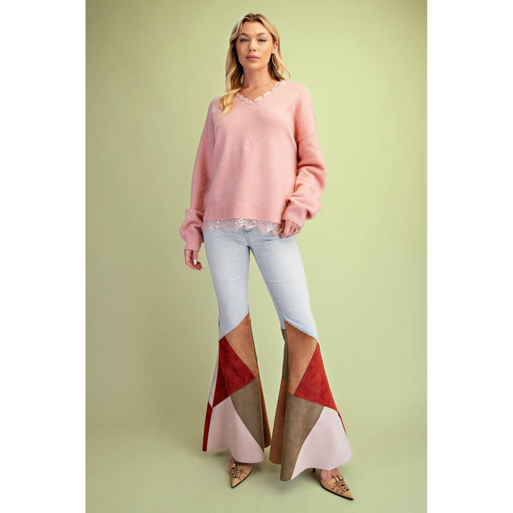 Coral V-neck sweater with long balloon sleeves and lace trim