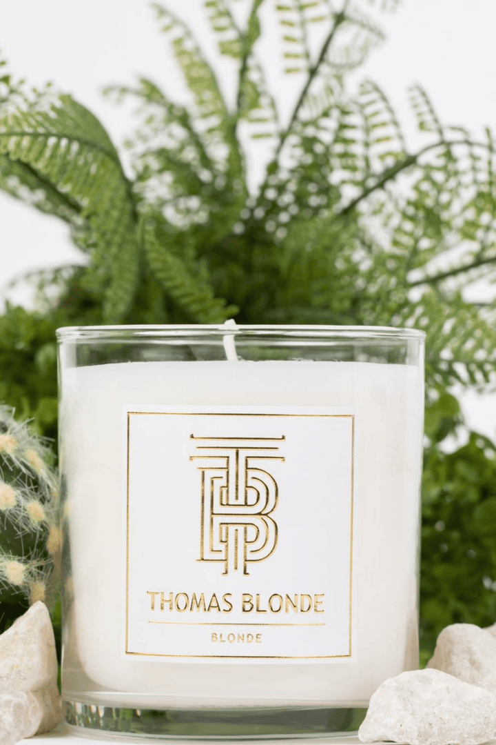 Thomas Blonde Signature Scent 12 oz hand-poured candle in a clear glass jar.