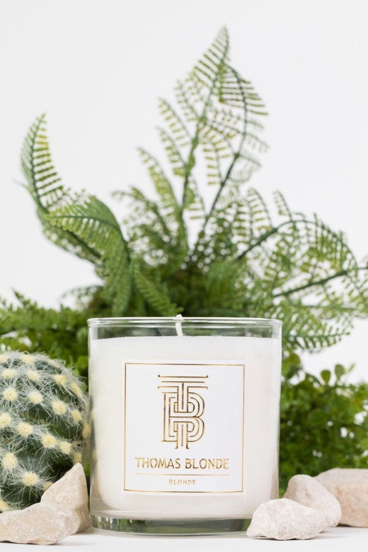 Thomas Blonde Signature Scent 12 oz hand-poured candle in a clear glass jar.