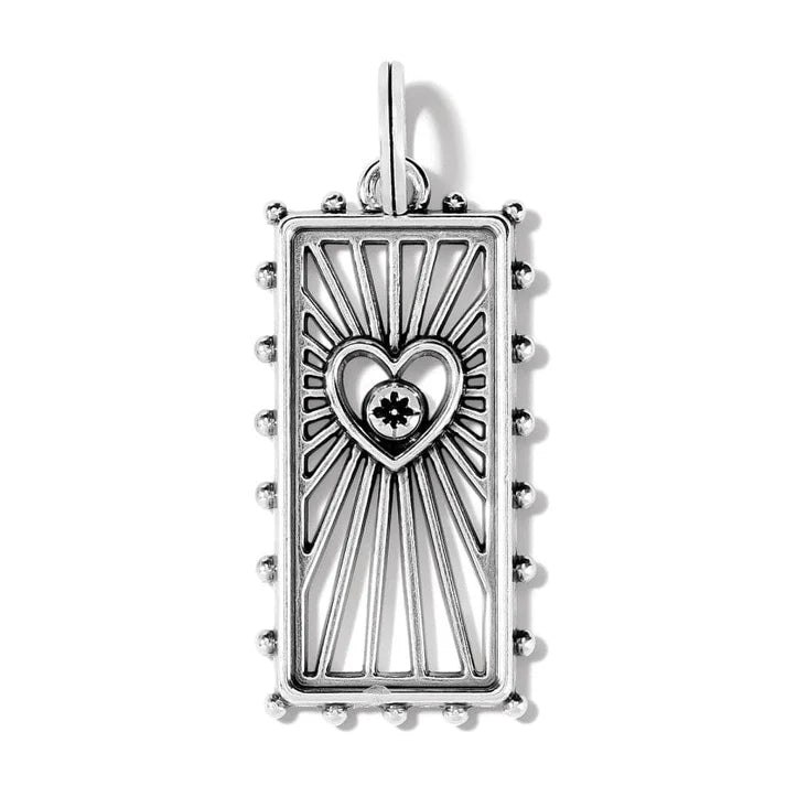 Close-up of the silver-plated Treasured Heart Amulet showing the "beaming" texture and fine crystal settings.