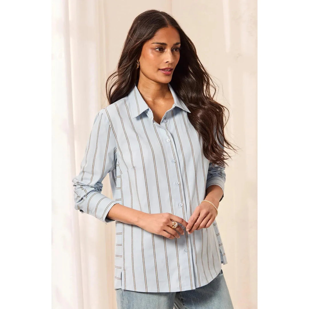 Model wearing the Tribal blue fog striped stretch poplin button-front shirt styled casually.