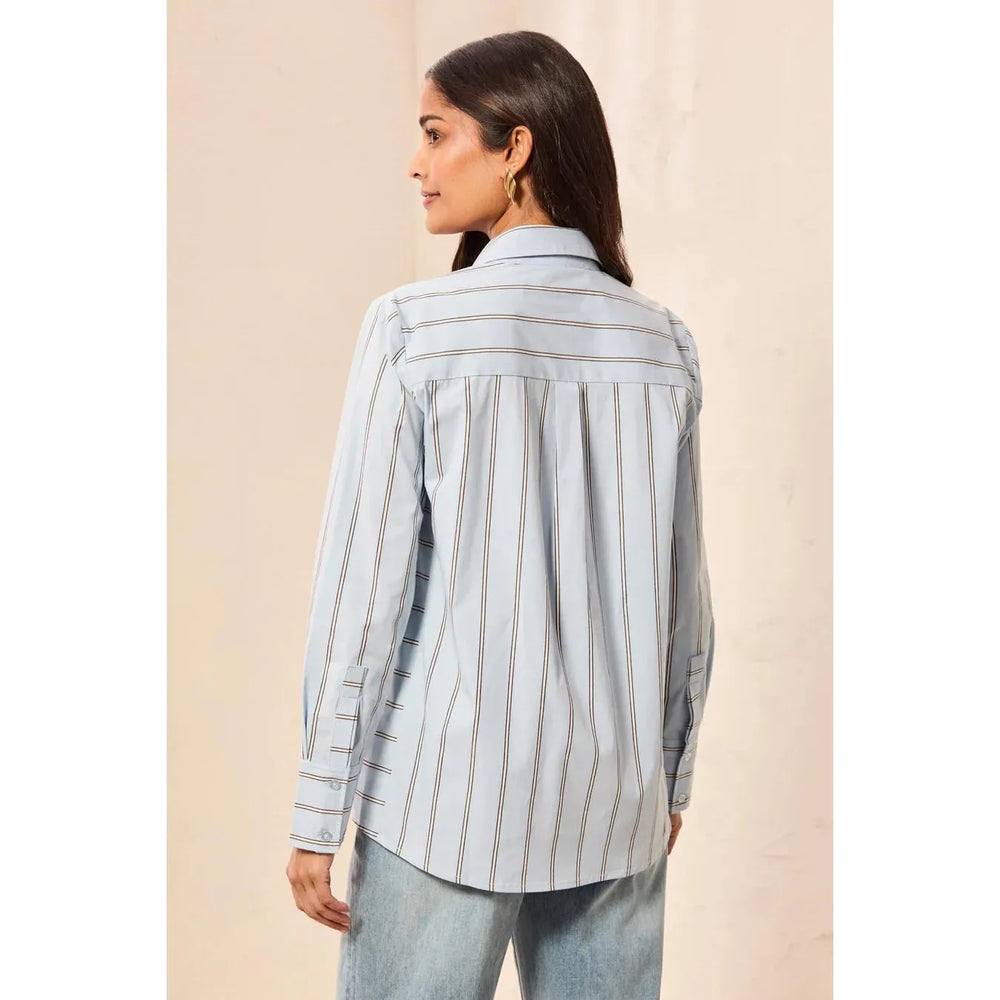 Alternate view of the Tribal striped blue fog women's boutique blouse showing the architectural side panels.