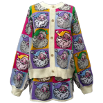 Close-up of the hand-embellished Santa design and pastel colorblock knit detailing.