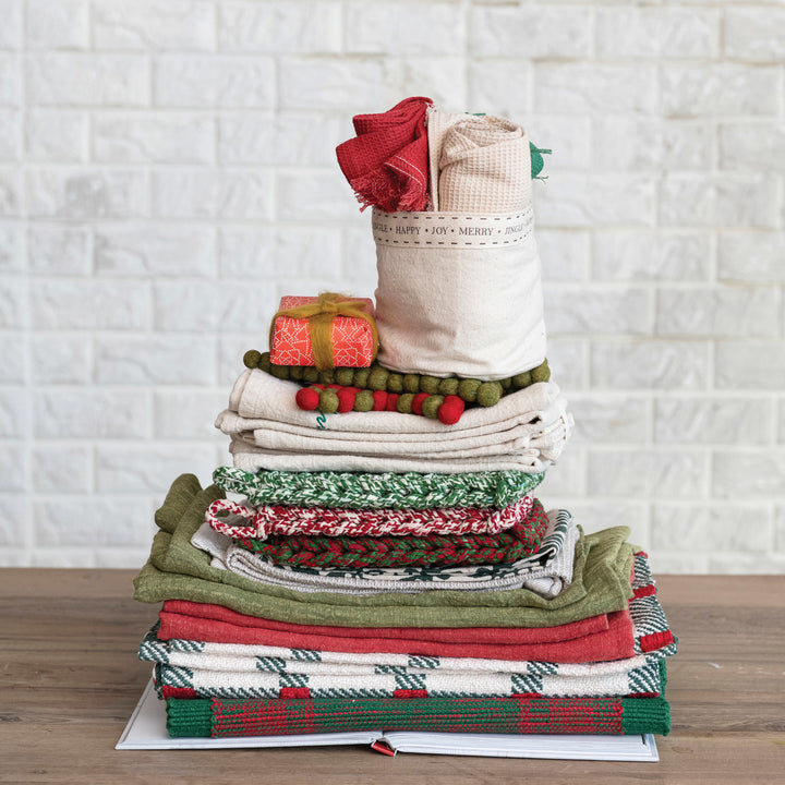 Creative Coop Melange Cotton Crocheted Pot Holder in red, green, and brown melange designs.
