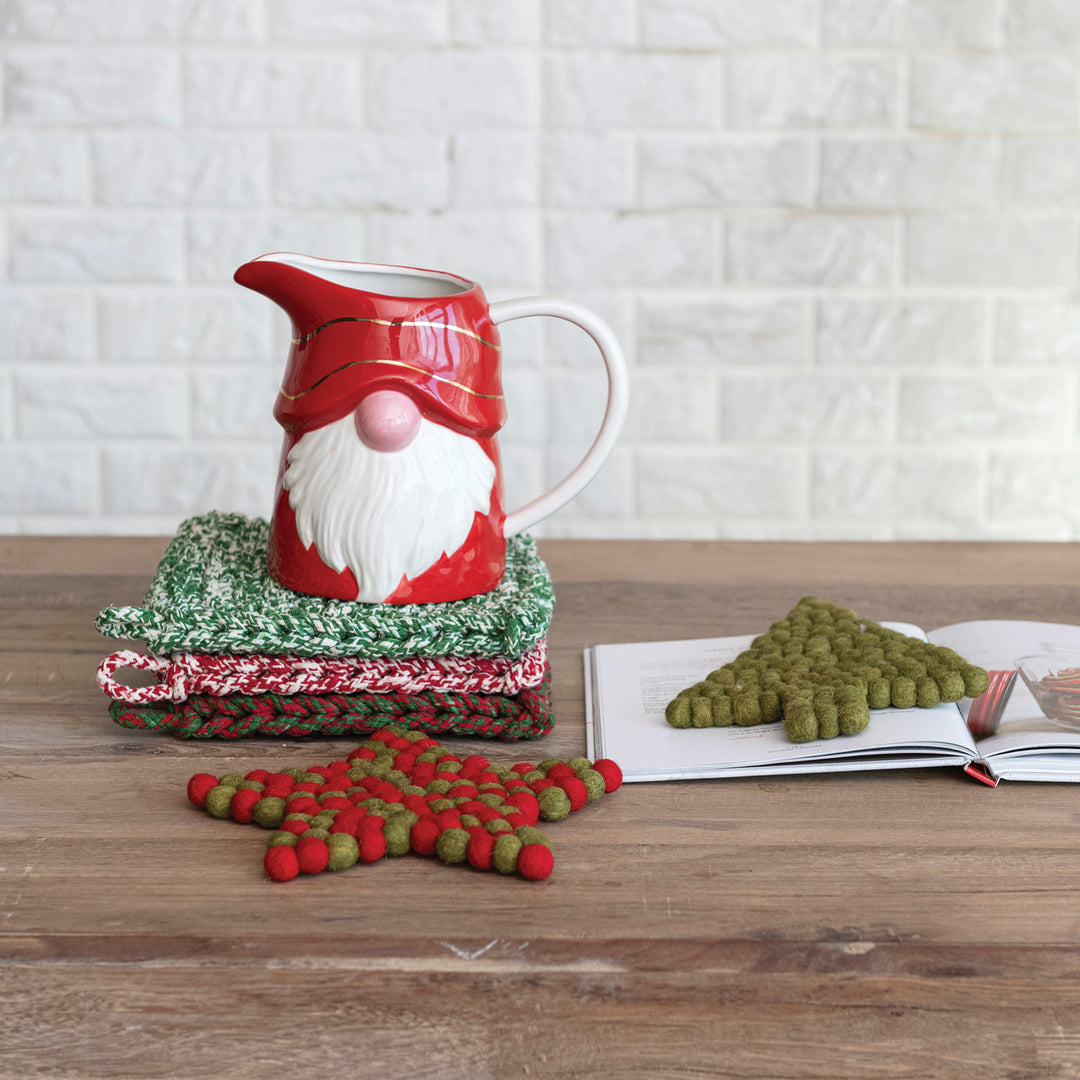 Creative Coop Melange Cotton Crocheted Pot Holder in red, green, and brown melange designs.