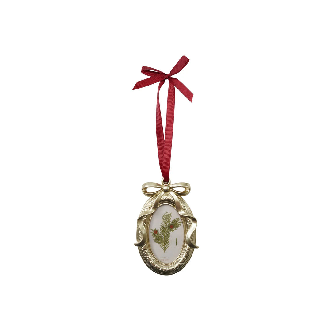 Creative Co-op resin photo frame Christmas ornament topped with a bow, holding a small photo